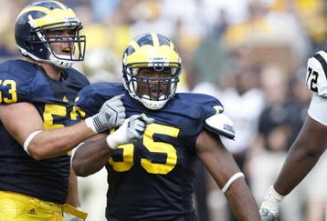 ANN ARBOR, MI - SEPTEMBER 5:  Brandon Graham #55 and Ryan Van Bergen #53 of the Michigan Wolverines celebrate a play during the game against the Western Michigan Broncos on September 5, 2009 at Michigan Stadium in Ann Arbor, Michigan. (Photo by Gregory Shamus/Getty Images) 