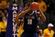 MILWAUKEE - JANUARY 31: Greg Monroe #10 of the Georgetown Hoyas looks to pass against the Marquette Golden Eagles defends on January 31, 2009 at the Bradley Center in Milwaukee, Wisconsin. Marquette defeated Georgetown 94-82. (Photo by Jonathan Daniel/Getty Images)