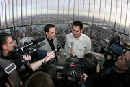 NEW YORK - NOVEMBER 24:  Jimmie Johnson 2009 NASCAR Sprint Cup Series Champion and New York Yankee Johnny Damon speak to the media at the top of the Empire State Building on November 24, 2009 in New York City. Jimmie Johnson is celebrating after winning his forth consecutive NASCAR Sprint Cup Series Championship.  (Photo by Mike Stobe/Getty Images for NASCAR)