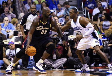 ORLANDO, FL - NOVEMBER 11:  Shaquille O'Neal #33 of the Cleveland Cavaliers looks to maneuver against Dwight Howard #12 of the Orlando Magic during the game on November 11, 2009 at Amway Arena in Orlando, Florida. NOTE TO USER: User expressly acknowledges and agrees that, by downloading and/or using this Photograph, user is consenting to the terms and conditions of the Getty Images License Agreement. (Photo by Sam Greenwood/Getty Images)
