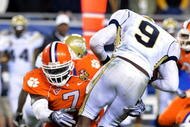 TAMPA, FL - NOVEMBER 28:  Defensive end Ricky Sapp #7 of the Clemson Tigers sacks quarterback Josh Nesbitt #9 of the Georgia Tech Yellow Jackets in the 2009 ACC Football Championship Game at Raymond James Stadium on December 5, 2009 in Tampa, Florida.  (Photo by Al Messerschmidt/Getty Images)