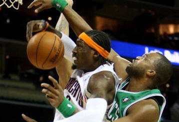 CHARLOTTE, NC - DECEMBER 01:  Shelden Williams #13 of the Boston Celtics fould Gerald Wallace #3 of the Charlotte Bobcats during their game at Time Warner Cable Arena on December 1, 2009 in Charlotte, North Carolina.  (Photo by Streeter Lecka/Getty Images)