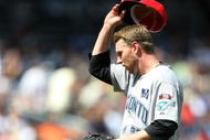 NEW YORK - JULY 04:  Roy Halladay #32 of the Toronto Blue Jays removes his hat against the New York Yankees on July 4, 2009 at Yankee Stadium in the Bronx borough of New York City.  (Photo by Nick Laham/Getty Images)