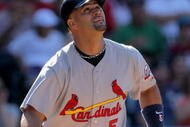 DENVER - SEPTEMBER 27:  Albert Pujols #5 of the St. Louis Cardinals takes an at bat against the Colorado Rockies at Coors Field on September 27, 2009 in Denver, Colorado. The Rockies defeated the Cardinals 4-3.  (Photo by Doug Pensinger/Getty Images)