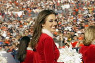 DENVER - DECEMBER 14: A cheerleader of the Cleveland Browns cheers during the game against the Denver Broncos on December 14, 2003 at Invesco Field at Mile High in Denver, Colorado. The Broncos defeated the Browns 23-20 in overtime. (Photo by Brian Bahr/Getty Images)
