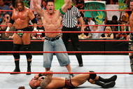 LAS VEGAS - AUGUST 24:  (L-R) Wrestlers Triple H, John Cena and Shawn Michaels celebrate as wrestler Randy Orton lies on the canvas during the WWE Monday Night Raw show at the Thomas & Mack Center August 24, 2009 in Las Vegas, Nevada.  (Photo by Ethan Miller/Getty Images)