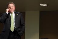 SOUTH BEND, IN - DECEMBER 11: Brian Kelly talks on his phone shortly after being named new football head coach at Notre Dame University on December 11, 2009 in South Bend, Indiana. Kelly most recently led the University of Cincinnati to two consecutive Bowl Championship Series appearances including a perfect 12-0 record this past season. (Photo by Frank Polich/Getty Images)