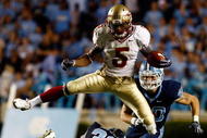 CHAPEL HILL, NC - OCTOBER 22:  Greg Reid #5 of the Florida State Seminoles leaps over North Carolina Tar Heels defenders Kennedy Tinsley #36 and Hunter Furr, #40 at Kenan Stadium on October 22, 2009 in Chapel Hill, North Carolina.  (Photo by Scott Halleran/Getty Images)
