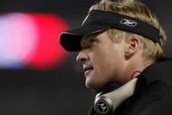 30 Dec 2001:  Head coach Jon Gruden of the Oakland Raiders looks less than thrilled after the offense turned the ball over on downs to the Denver Broncos late in the fourth quarter at Mile High Stadium in Denver, Colorado.  The Broncos won 23-17.  DIGITAL IMAGE Mandatory Credit: Brian Bahr/Getty Images