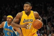 LOS ANGELES, CA - DECEMBER 01:  Ron Artest #37 of the Los Angeles Lakers beats James Posey #41 of the New Orleans Hornets off the dribble at Staples Center on December 1, 2009 in Los Angeles, California.  (Photo by Harry How/Getty Images) NOTE TO USER: User expressly acknowledges and agrees that, by downloading and/or using this Photograph, user is consenting to the terms and conditions of the Getty Images License Agreement.