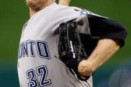 ST LOUIS, MO - JULY 14:  American League All-Star Roy Halladay of the Toronto Blue Jays pitches during the 2009 MLB All-Star Game at Busch Stadium on July 14, 2009 in St Louis, Missouri.  (Photo by Morry Gash-Pool/Getty Images)