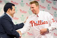 PHILADELPHIA - DECEMBER 16:  Pitcher Roy Halladay (R) of the Philadelphia Phillies shakes hands with senior vice president and general manager Ruben Amaro, Jr. after signing with the the team on December 16, 2009 at Citizens Bank Park in Philadelphia, Pennsylvania. (Photo by Drew Hallowell/Getty Images)