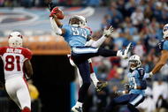 NASHVILLE, TN - NOVEMBER 29: Steve Breaston #15 of the Arizona Cardinals breaks up a pass with Keith Bulluck #53 of the Tennessee Titans during their game at LP Field on November 29, 2009 in Nashville, Tennessee. (Photo by Streeter Lecka/Getty Images)