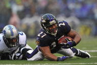 BALTIMORE - DECEMBER 13:  Ray Rice #27 of the Baltimore Ravens runs the ball against the Detroit Lions at M&T Bank Stadium on December 13, 2009 in Baltimore, Maryland. The Ravens defeated the Lions 48-3. (Photo by Larry French/Getty Images)
