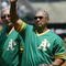 OAKLAND, CA - AUGUST 2:  Baseball hall of famer Reggie Jackson of the 1973 World Champion Oakland Athletics waves to the crowd during a ceremony before the game against the New York Yankees at the Network Associates Coliseum on August 2, 2003 in Oakland, California. The Yankees defeated the Athletics 10-7. (Photo by Justin Sullivan/Getty Images)