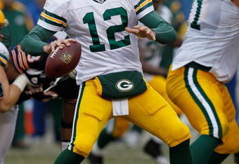 CHICAGO - DECEMBER 13: Aaron Rodgers #12 of the Green Bay Packers looks for a receiver against the Chicago Bears at Soldier Field on December 13, 2009 in Chicago, Illinois. The Packers defeated the Bears 21-14. (Photo by Jonathan Daniel/Getty Images)
