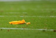DENVER - SEPTEMBER 20:  A penalty flag lies on the turf as the Cleveland Browns face the Denver Broncos during NFL action at Invesco Field at Mile High on September 20, 2009 in Denver, Colorado. The Broncos defeated the Browns 27-6.  (Photo by Doug Pensinger/Getty Images)