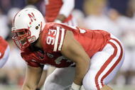 ARLINGTON, TX - DECEMBER 5: Ndamukong Suh #93 of the Nebraska Cornhuskers gets ready at the line during Big 12 Football Championship game against the Texas Longhorns at Cowboys Stadium on December 5, 2009 in Arlington, Texas. (Photo by Jamie Squire/Getty Images)
