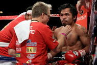 LAS VEGAS - NOVEMBER 14:  Manny Pacquiao sits in his corner between rounds with trainer Freddie Roach against Miguel Cotto during their WBO welterweight title fight at the MGM Grand Garden Arena on November 14, 2009 in Las Vegas, Nevada.  (Photo by Al Bello/Getty Images)