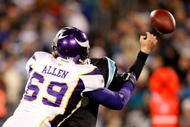 CHARLOTTE, NC - DECEMBER 20:  Jared Allen #69 of the Minnesota Vikings forces a fumble by quarterback Matt Moore #3 of the Carolina Panthers at Bank of America Stadium on December 20, 2009 in Charlotte, North Carolina.  (Photo by Kevin C. Cox/Getty Images)
