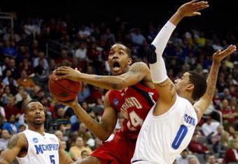 KANSAS CITY, MO - MARCH 21:   Cliff Tucker #24 of the Maryland Terrapins jumps to the basket for a shot attempt against Shawn Taggart #0 of the Memphis Tigers in the first half during the second round of the NCAA Division I Men's Basketball Tournament at the Sprint Center on March 21, 2009 in Kansas City, Missouri.  (Photo by Jamie Squire/Getty Images)