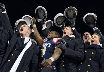 PHILADELPHIA - DECEMBER 12: Quarterback Ricky Dobbs #4 of the Navy Midshipmen, and game MVP, celebrates their 17-3 victory over the Army Black Knights on December 12, 2009 at Lincoln Financial Field in Philadelphia, Pennsylvania. (Photo by Drew Hallowell/Getty Images)