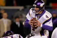 CHICAGO - DECEMBER 28: Brett Favre #4 of the Minnesota Vikings is sacked by Mark Anderson #97 of the Chicago Bears as Phil Loadholt #71 holds Anderson to the ground at Soldier Field on December 28, 2009 in Chicago, Illinois. The Bears defeated the Vikings 36-30 in overtime. (Photo by Jonathan Daniel/Getty Images)