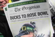 EUGENE, OR - DECEMBER 03: Fans of the Oregon Ducks celebrate after the Ducks defeated the Oregon State Beavers 33-37 at Autzen Stadium on December 3, 2009 in Eugene, Oregon. (Photo by Tom Hauck/Getty Images)