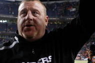 DENVER - DECEMBER 20:  Oakland Raiders head coach Tom Cable celebrates a victory over the Denver Broncos at Invesco Field at Mile High on December 20, 2009 in Denver, Colorado. The Raiders defeated the Broncos 20-19.  (Photo by Jeff Gross/Getty Images)