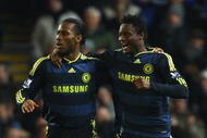 BLACKBURN, ENGLAND - DECEMBER 02:  Didier Drogba of Chelsea celebrates with team mate John Obi Mikel  (R) after scoring his team's first goal during the Carling Cup Quarter Final match between Blackburn Rovers and Chelsea at Ewood Park on December 2, 2009 in Blackburn, England.  (Photo by Matthew Lewis/Getty Images)