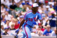 Outfielder Tim Raines of the Montreal Expos drops his bat and prepares to run.