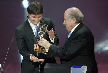 ZURICH - SWITZERLAND - DECEMBER 21:  Argentina's Lionel Messi receives the 2009 FIFA World Player Trophy from UEFA President Michel Platini and FIFA President Sepp Blatter during the FIFA World Player Gala 2009 at the Kongresshaus on December 21, 2009 in Zurich, Switzerland.  (Photo by Pascal Muller/Getty Images)