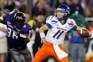 GLENDALE, AZ - JANUARY 04:  Quarterback Kellen Moore #11 of the Boise State Broncos passes the ball in the second half as Jerry Hughes #98 of the TCU Horned Frogs rushes in during the Tostitos Fiesta Bowl at the Universtity of Phoenix Stadium on January 4, 2010 in Glendale, Arizona.  (Photo by Jed Jacobsohn/Getty Images)