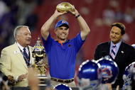 GLENDALE, AZ - JANUARY 04: Head coach Chris Petersen of the Boise State Broncos celebrates after defeating the TCU Horned Frogs 17-10 during the Tostitos Fiesta Bowl at the Universtity of Phoenix Stadium on January 4, 2010 in Glendale, Arizona. (Photo by Jamie Squire/Getty Images)