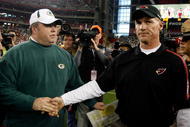 GLENDALE, AZ - JANUARY 03:  Head coach Ken Whisenhunt of the Arizona Cardinals greets Mike McCarthy of the Green Bay Packers following the NFL game at the Universtity of Phoenix Stadium on January 3, 2010 in Glendale, Arizona. The Packers defeated the Cardinals 33-7.  (Photo by Christian Petersen/Getty Images)