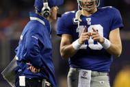 EAST RUTHERFORD, NJ - NOVEMBER 08:  Head coach Tom Coughlin of the New York Giants talks with Eli Manning #10 against the San Diego Chargers at Giants Stadium on November 8, 2009 in East Rutherford, New Jersey.  (Photo by Nick Laham/Getty Images)