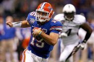 NEW ORLEANS - JANUARY 01:  Quarterback Tim Tebow #15 of the Florida Gators runs the ball against the Cincinnati Bearcats during the Allstate Sugar Bowl at the Louisana Superdome on January 1, 2010 in New Orleans, Louisiana.  (Photo by Matthew Stockman/Getty Images)