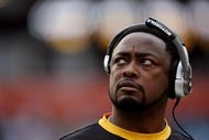 MIAMI - JANUARY 03:  Head coach Mike Tomlin of the Pittsburgh Steelers looks toward the scoreboard after the Miami Dolphins pull to within three points in the fourth quarter at Land Shark Stadium on January 3, 2010 in Miami, Florida. The Steelers defeated the Dolphins 30-24.  (Photo by Doug Benc/Getty Images)