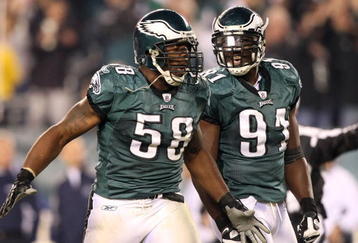 PHILADELPHIA - NOVEMBER 08:  Trent Cole #58 and Chris Clemons #91 of the Philadelphia Eagles celebrate after Cole sacked Tony Romo #9 of the Dallas Cowboys in the third quarter at Lincoln Financial Field on November 8, 2009 in Philadelphia, Pennsylvania.  (Photo by Al Bello/Getty Images)