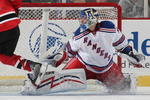 NEWARK, NJ - SEPTEMBER 16: Zach Parise #9 of the New Jersey Devils  scores in the shootout against Chad Johnson #96 of the New York Rangers at the Prudential Center on September 16, 2009 in Newark, New Jersey. The Devils defeated the Rangers 3-2 in the shoot out. (Photo by Bruce Bennett/Getty Images)