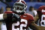 ATLANTA - DECEMBER 5: (L-R) Mark Ingram #22, Colin Peek #84 and Roy Upchurch #5 of the Alabama Crimson Tide celebrate after Ingram scored a 3-yard rushing touchdown in the second quarter against the Florida Gators during the SEC Championship game at Georgia Dome on December 5, 2009 in Atlanta, Georgia. (Photo by Chris Graythen/Getty Images)