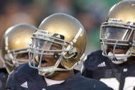 SOUTH BEND, IN - NOVEMBER 21: Brian Smith #58 of the Notre Dame Fighting Irish celebrates with teammates during the game against the Univeristy of Connecticut Huskies at Notre Dame Stadium on November 21, 2009 in South Bend, Indiana. Connecticut defeated Notre Dame 33-30 in overtime. (Photo by Jonathan Daniel/Getty Images)