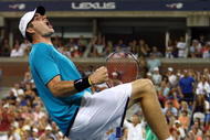 NEW YORK - SEPTEMBER 05:  John Isner celebrates after defeating Andy Roddick during day six of the 2009 U.S. Open at the USTA Billie Jean King National Tennis Center on September 5, 2009 in the Flushing neighborhood of the Queens borough of New York City.  (Photo by Al Bello/Getty Images)
