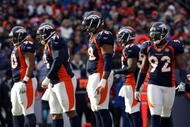 DENVER - JANUARY 03:  (L-R) Kenny Peterson #90, Ronald Fields #91, Ryan McBean #98 and Elvis Dumervil #92 of the Denver Broncos defense prepare for action against the Kansas City Chiefs during NFL action at Invesco Field at Mile High on January 3, 2010 in Denver, Colorado. The Chiefs defeated the Broncos 44-24.  (Photo by Doug Pensinger/Getty Images)
