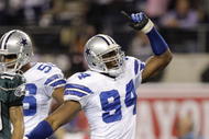 ARLINGTON, TX - JANUARY 9: DeMarcus Ware #94 of the Dallas Cowboys reacts after the Cowboys recovered a second quarter fumble by Michael Vick #7 of the Philadelphia Eagles during the 2010 NFC wild-card playoff game at Cowboys Stadium on January 9, 2010 in Arlington, Texas. (Photo by Jamie Squire/Getty Images)