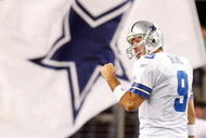 ARLINGTON, TX - JANUARY 03: Quarterback Tony Romo #9 of the Dallas Cowboys celebrates a touchdown by Felix Jones against the Philadelphia Eagles at Cowboys Stadium on January 3, 2010 in Arlington, Texas. (Photo by Ronald Martinez/Getty Images)