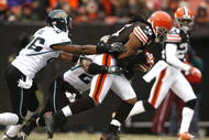CLEVELAND - JANUARY 03:  Joshua Cribbs #16 of the Cleveland Browns runs by Derek Cox #21 and Michael Coe #26 of the Jacksonville Jaguars at Cleveland Browns Stadium on January 3, 2010 in Cleveland, Ohio.  (Photo by Matt Sullivan/Getty Images)