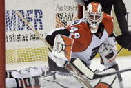 PITTSBURGH, PA - JANUARY 7: Michael Leighton #49 of the Philadelphia Flyers makes a save as Sidney Crosby #87 of the Pittsburgh Penguins crashes the net in the third period at Mellon Arena on January 7, 2010 in Pittsburgh, Pennsylvania. (Photo by Justin K. Aller/Getty Images)
