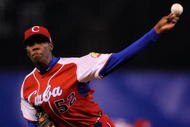 MEXICO CITY - MARCH 10:  Aroldis Chapman #52 of Cuba pitches against Australia during the first inning of the game during the 2009 World Baseball Classic Pool B match on March 10, 2009 at the Estadio Foro Sol in Mexico City, Mexico.  (Photo by Kevork Djansezian/Getty Images)