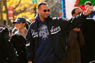 NEW YORK - NOVEMBER 06:  Derek Jeter #2 of the New York Yankees and actress Minka Kelly (L) celebrate on a float during the New York Yankees World Series Victory Parade on November 6, 2009 in New York, New York.  (Photo by Michael Loccisano/Getty Images)